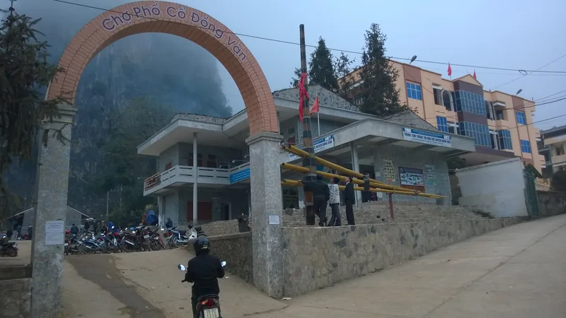 An arched gateway reading Cho Pho Co Dong Van marks the entrance to Dong Van old market town in Ha Giang.